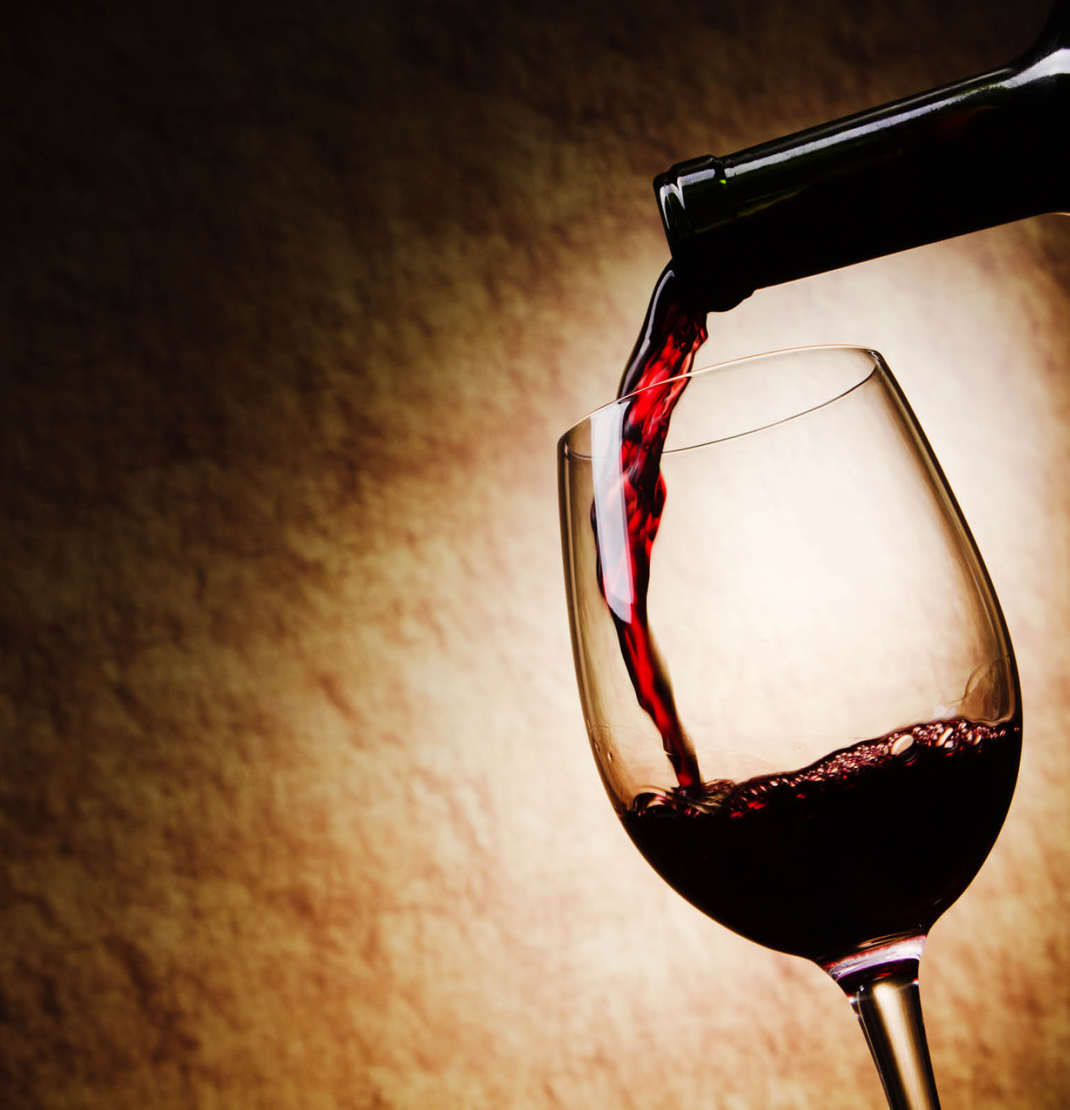 Red Wine glass and Bottle on a grange