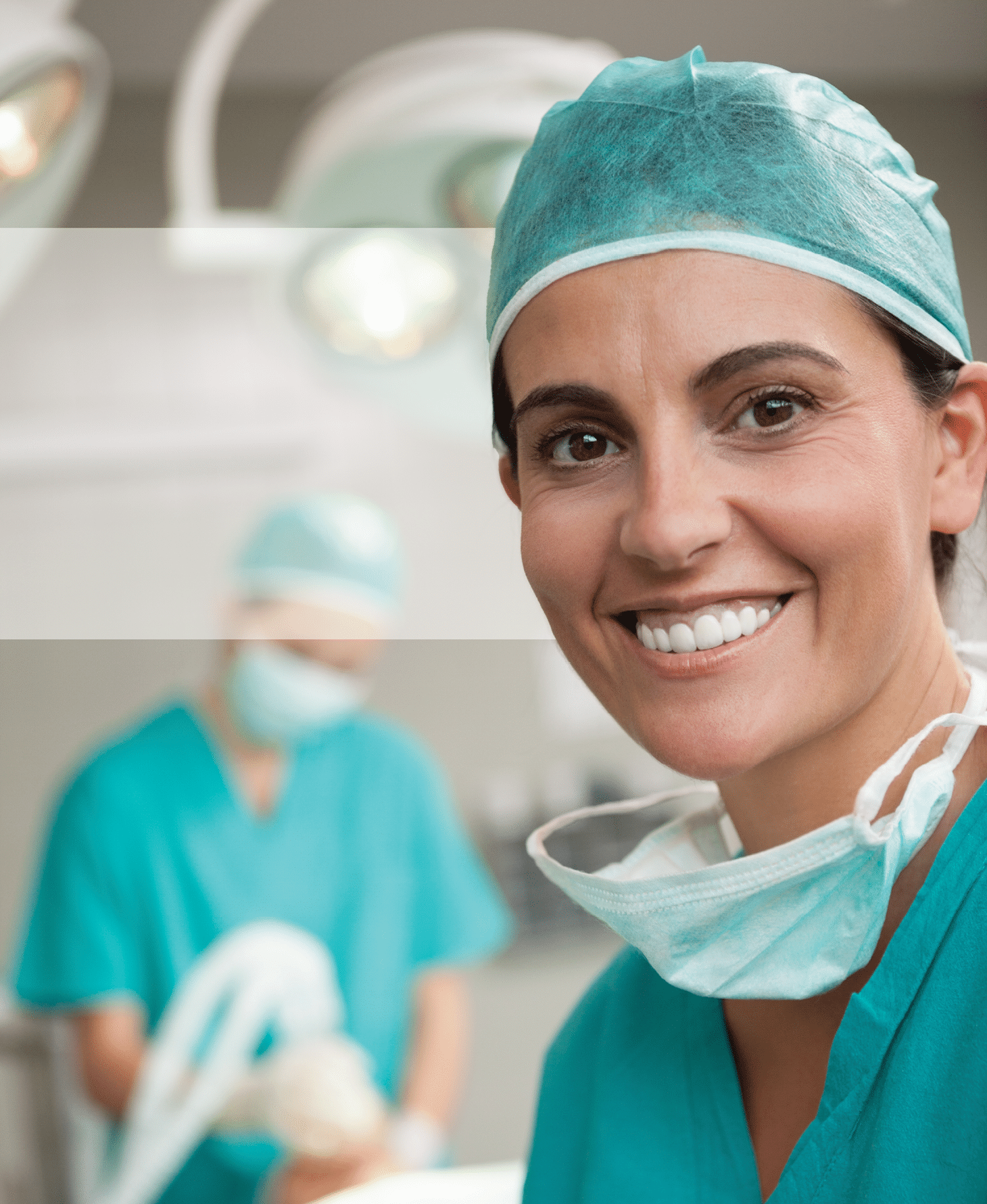 Woman surgeon smiling in a surgical room