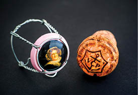 Tambov, Russian Federation - February 22, 2018 Veuve Clicquot Champagne cork and muselet with cap on black background  Studio shot 