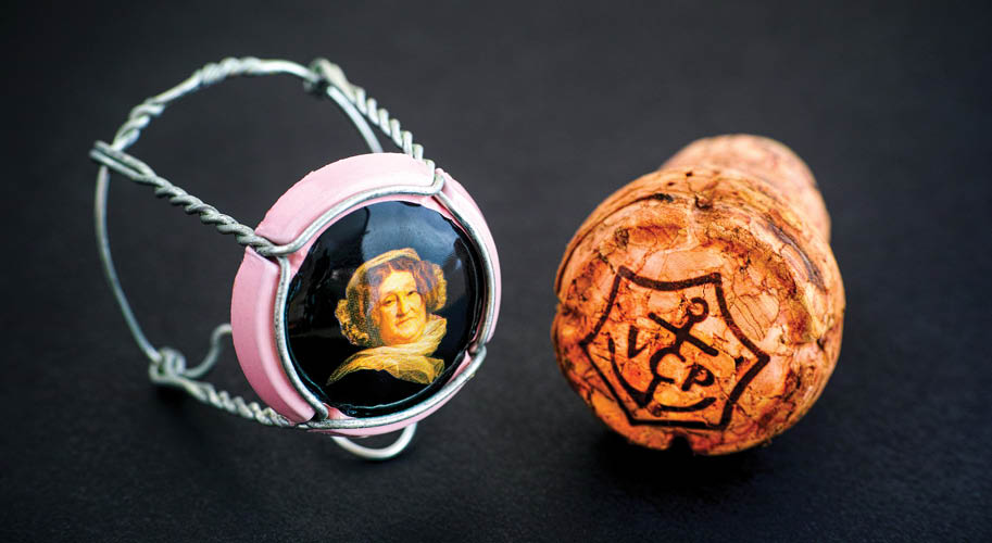 Tambov, Russian Federation - February 22, 2018 Veuve Clicquot Champagne cork and muselet with cap on black background  Studio shot 