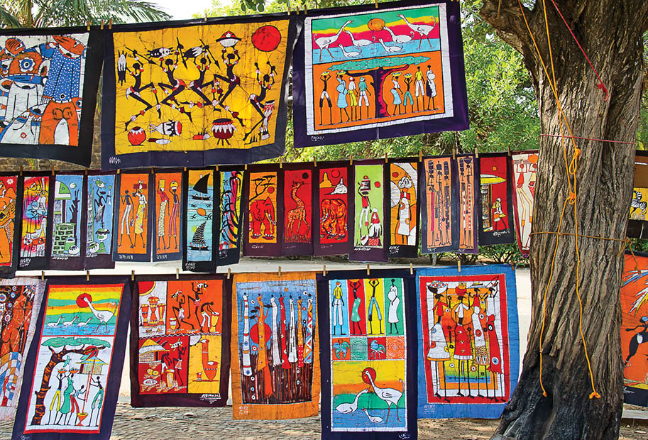 MAPUTO, MOZAMBIQUE - APRIL 29: Traditional african batik painting on the market in Maputo, Mozambique on April 29, 2012. The local market is one of the tourists attraction of the city.
